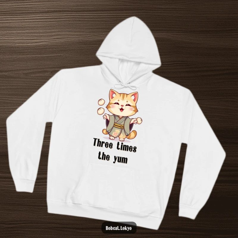 Funny Bobcat Hoodie: A bobcat in an ornate kimono cheerfully juggling three small dumplings, a cozy and humorous apparel choice.