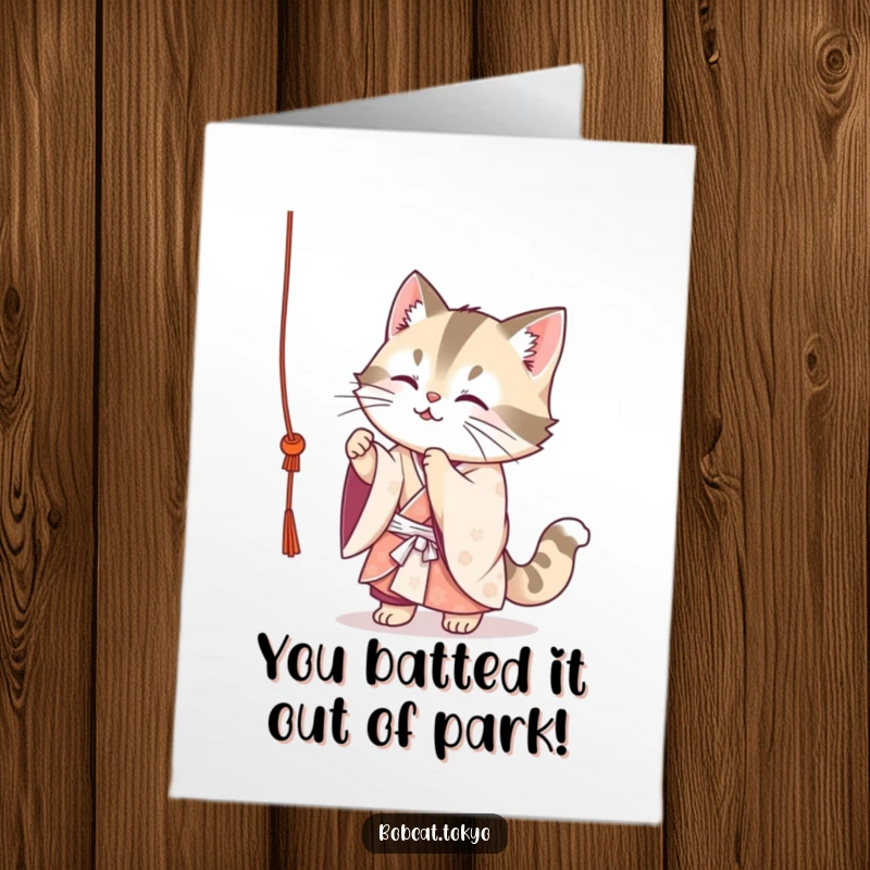 Funny Free Printable Congratulations Card: Adorable bobcat in an ornate kimono cheerfully juggling three small dumplings, looking skilled.